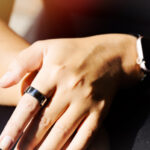 Woman wearing smart ring on her hand. Concept sport and healthy lifestyle