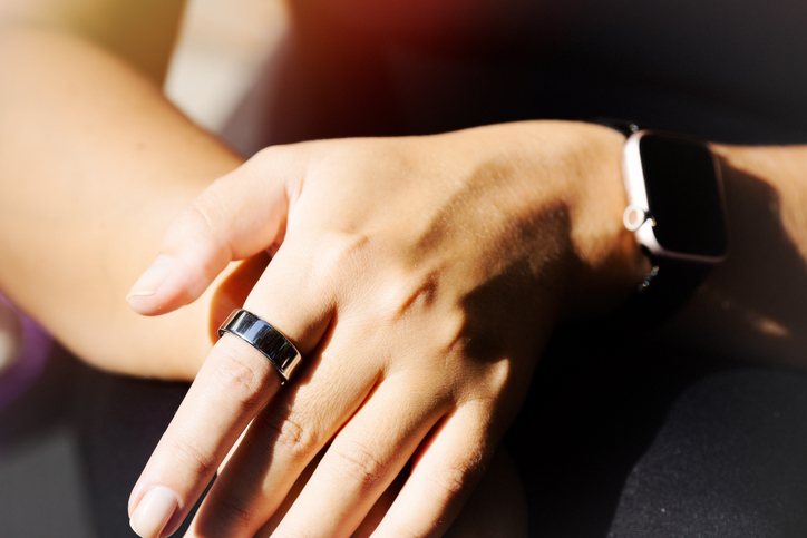 Woman wearing smart ring on her hand. Concept sport and healthy lifestyle